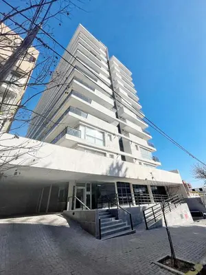 a large white building with stairs in front of it at Torre Leonardo Carlos Paz in Villa Carlos Paz