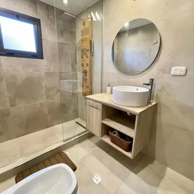 a bathroom with a sink and a mirror at Agrippina in Villa Carlos Paz