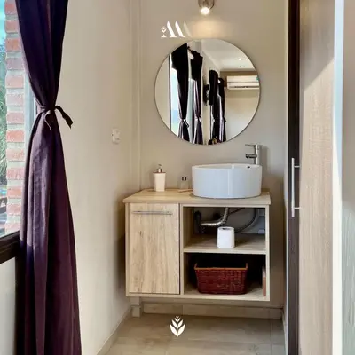 a bathroom with a sink and a mirror at Agrippina in Villa Carlos Paz