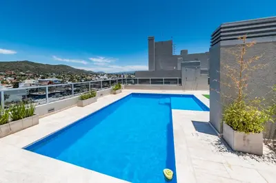 a swimming pool on the roof of a house at Edificio Opera en Villa Carlos Paz - Pileta en Terraza e increíbles vistas in Villa Carlos Paz