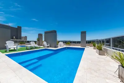 a swimming pool on the roof of a building at Edificio Opera en Villa Carlos Paz - Pileta en Terraza e increíbles vistas in Villa Carlos Paz
