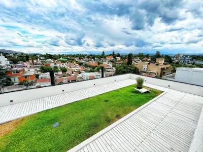 a view of a city from the roof of a building at Don Francisco Apartamentos in Villa Carlos Paz
