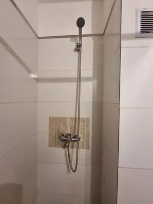 a shower with a glass door in a bathroom at Departamento en el corazón de Guemes! in Cordoba