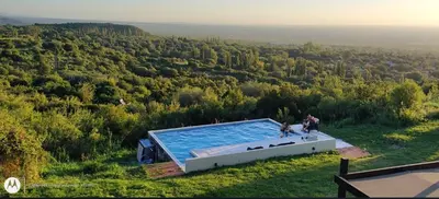 an overhead view of a swimming pool in a field at Mirador Merlo in Merlo