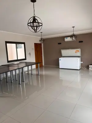 a living room with a table and a refrigerator at Depto Tatiana zona céntrica Carlos Paz in Villa Carlos Paz