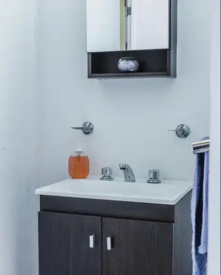 a bathroom with a sink and a mirror at Posada The Gringos in Villa Yacanto