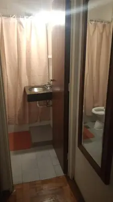 a bathroom with a sink and a toilet and a mirror at Estancia Nueva Córdoba in Cordoba
