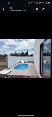 a picture of a swimming pool in a house at Casa Nueva in Villa Rumipal