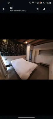 a picture of a bedroom with a white bed at Casa Nueva in Villa Rumipal