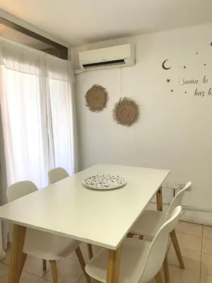 a white table and chairs in a room at Departamento en Nueva Cordoba Centro Bv Illia in Cordoba