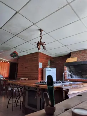 a ceiling fan in a kitchen with a table at Casita serrana in Cassaffousth