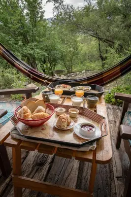a picnic table with a tray of food on it at El Observador del Tiempo in San Javier