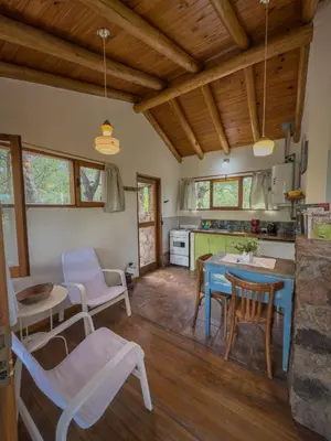a kitchen and dining room with a table and chairs at El Observador del Tiempo in San Javier