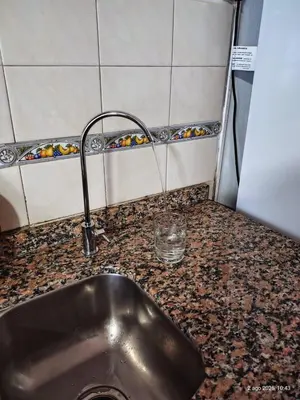 a sink in a kitchen with a counter top at Departamento Santa Rosa in Cordoba