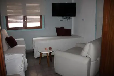a living room with a couch and a table at Departamento Santa Rosa in Cordoba