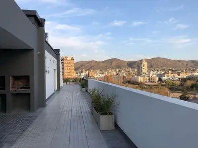 a balcony of a building with a view of a city at Edificio Veneto IV - Departamento de un dormitorio en pleno centro in Villa Carlos Paz