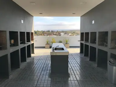 a bathroom with a sink in the middle of a room at Edificio Veneto IV - Departamento de un dormitorio en pleno centro in Villa Carlos Paz