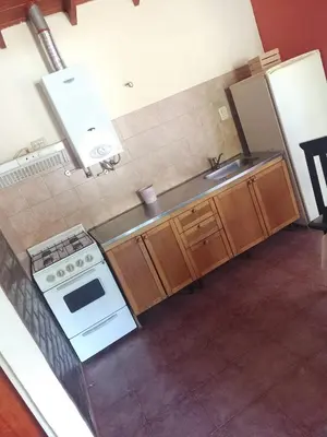 an overhead view of a kitchen with a stove and a sink at Cabañas Nicasio in Merlo