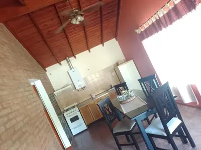 an overhead view of a kitchen with a table and chairs at Cabañas Nicasio in Merlo