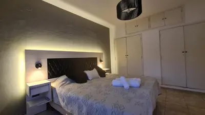 a bedroom with a bed with two pillows on it at LitStay Paso de los Andes PA in Cordoba