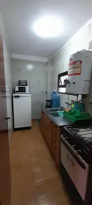 a kitchen with a sink and a mixer in it at Departamento pleno centro de Villa Carlos Paz in Villa Carlos Paz