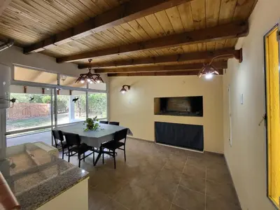 a dining room with a table and chairs at Otto's Haus in Villa General Belgrano