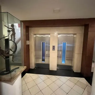 a hallway with two elevators in a building at Montevideo 20 Bis in Cordoba
