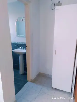 a bathroom with a sink and a mirror at Cabañas Los Cerezos in Mina Clavero