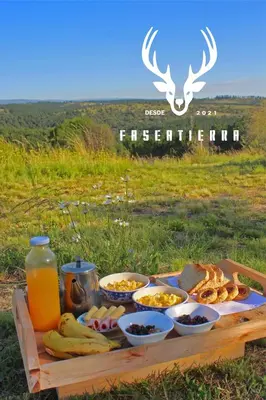 a tray of food on a table with drinks and snacks at Fase a Tierra in Atos Pampa