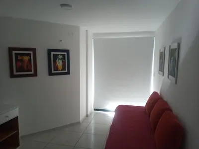 a living room with a red couch and a window at Tranquilidad, privacidad y relax in Cordoba