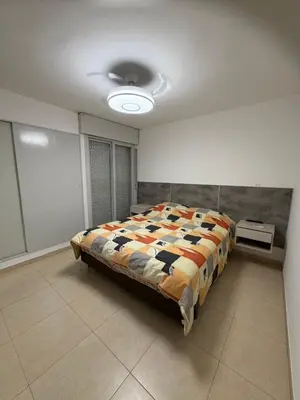 a bedroom with a large bed in a room at Casa Villa CARLOS PAZ CERCA DE COSTANERA in Villa Carlos Paz