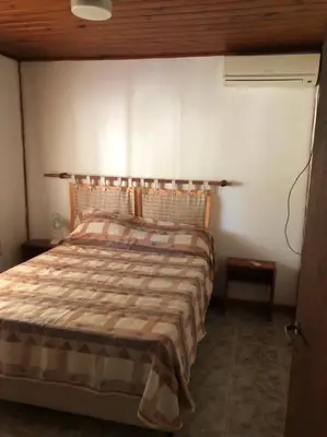 a bedroom with a bed in a room at Gratitud! in Almafuerte
