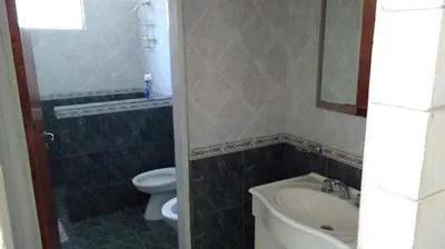 a bathroom with a toilet and a tub and a sink at La casa de Mayú in San Antonio de Arredondo