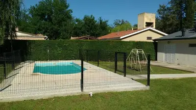 a batting cage with a swing in a backyard at La casa de Mayú in San Antonio de Arredondo