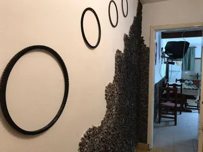 a mirror on the wall of a living room at Departamento Pama in Santa Rosa de Calamuchita