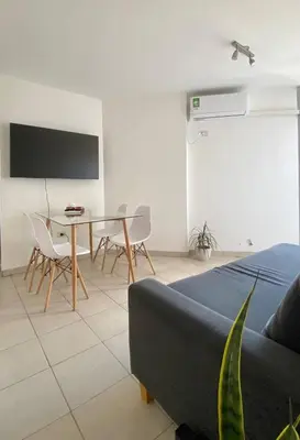 a living room with a tv and a table and chairs at Espejito espejito in Cordoba