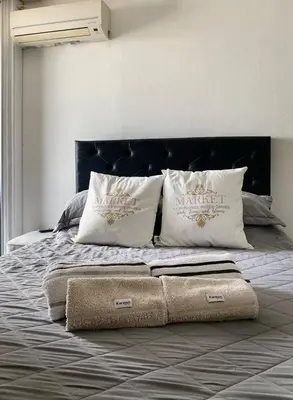 a bed with two pillows on top of it at Espejito espejito in Cordoba
