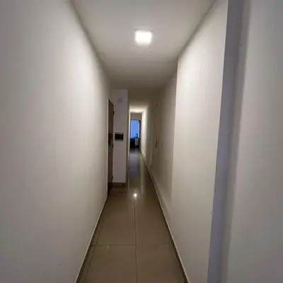 a long hallway with white walls and a long corridor at Mairea II bis in Cordoba