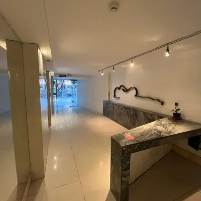 a room with a stone bench and a wall with lights at Mairea II bis in Cordoba