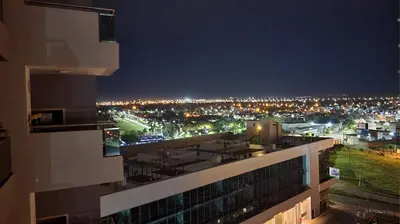 a view of a city at night from a building at Gama Top con cochera in Cordoba