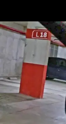 a red and white pole with the number on it at Gama Top con cochera in Cordoba