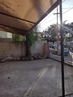 an empty parking lot with a covering on a building at QUIRUS DORMIS in Villa Carlos Paz