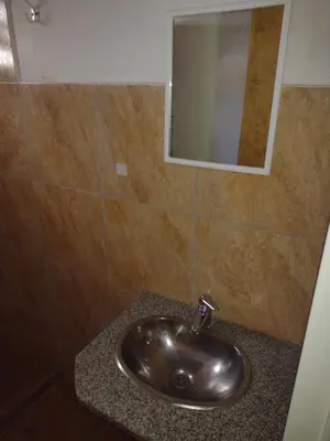 a sink in a bathroom with a mirror at Los jilgeros in Santa Rosa de Calamuchita
