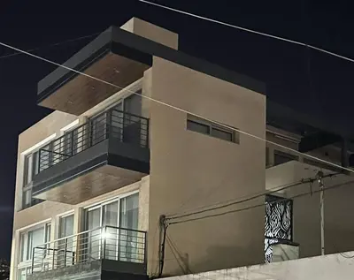 a building with balconies on the side of it at LUMINOSO piso con jacuzzi in Alta Gracia