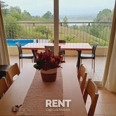 a table with a potted plant sitting on top of it at Condominio Monte Molinos - dpto en Nautico, 2 dormitorios y vista al lago in Villa Ciudad de America
