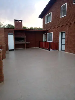 a large patio in front of a brick building at RESIDENCIA EL TALA in Cordoba