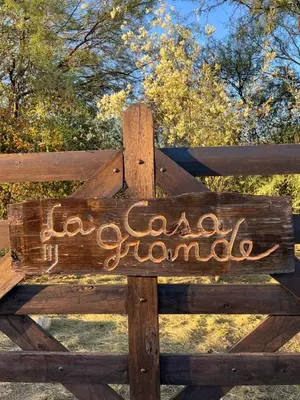 a wooden sign on a fence with the words corona diamonds at Casa Grande Reservas por privado in San Javier