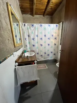 a bathroom with a sink and a shower curtain at Casa Grande Reservas por privado in San Javier