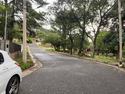 a white car parked on the side of a road at Apartamento Plaza Las Vertientes in Villa Carlos Paz