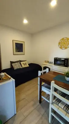 a living room with a couch and a table at Apartamento Plaza Las Vertientes in Villa Carlos Paz